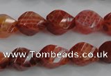 CAG582 15.5 inches 10*14mm faceted & twisted rice natural fire agate beads
