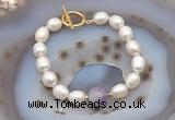 CFB904 Hand-knotted 9mm - 10mm rice white freshwater pearl & lavender amethyst bracelet