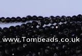 CAG2312 15.5 inches 4mm faceted round black line agate beads