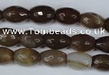 CAG3129 15.5 inches 10*14mm faceted rice brown line agate beads