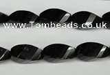 CAG4009 15.5 inches 8*16mm faceted & twisted rice black agate beads