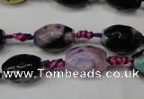 CAG5775 15 inches 10*14mm faceted rice fire crackle agate beads