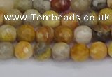 CAG9868 15.5 inches 4mm faceted round yellow crazy lace agate beads