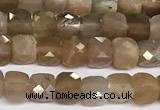 CCU1012 15 inches 4mm faceted cube sunstone beads