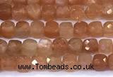 CCU885 15 inches 4mm faceted cube sunstone beads