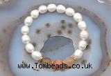 CFB913 9mm - 10mm rice white freshwater pearl & rainbow moonstone stretchy bracelet