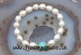 CFB926 9mm - 10mm rice white freshwater pearl & blue sea sediment jasper stretchy bracelet