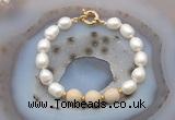 CFB946 Hand-knotted 9mm - 10mm rice white freshwater pearl & white fossil jasper bracelet