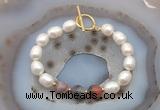 CFB963 Hand-knotted 9mm - 10mm rice white freshwater pearl & botswana agate bracelet