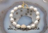 CFB968 Hand-knotted 9mm - 10mm rice white freshwater pearl & white fossil jasper bracelet