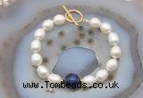 CFB980 Hand-knotted 9mm - 10mm rice white freshwater pearl & blue tiger eye bracelet