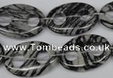 CFG301 15.5 inches 18*25mm carved oval black water jasper beads