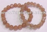CGB4587 7.5 inches 8mm - 9mm round sunstone beaded bracelets