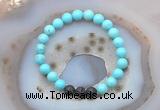 CGB6408 8mm round blue howlite & black lava beaded bracelets