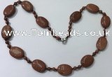 CGN201 22 inches 6mm round & 18*25mm oval goldstone necklaces