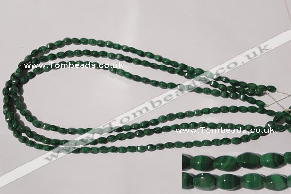 CMN222 15.5 inches 4*6mm faceted rice natural malachite beads