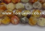 CNG6222 15.5 inches 6mm faceted nuggets yellow crazy lace agate beads