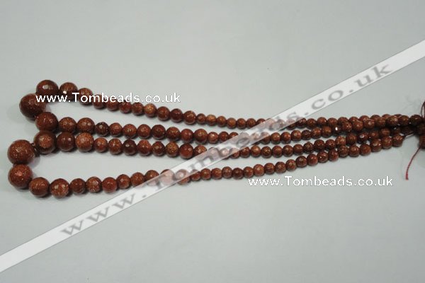 CRO736 15.5 inches 6mm – 14mm faceted round goldstone beads