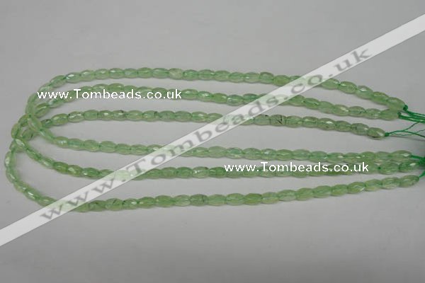 CRU165 15.5 inches 5*8mm faceted rice green rutilated quartz beads