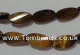 CTE1097 15.5 inches 8*15mm twisted & faceted oval yellow tiger eye beads