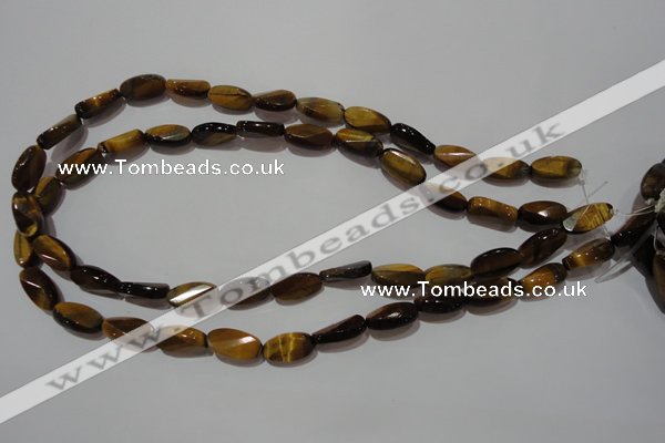 CTE1097 15.5 inches 8*15mm twisted & faceted oval yellow tiger eye beads