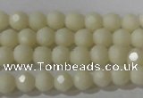 CTU1440 15.5 inches 4mm faceted round synthetic turquoise beads