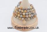 GMN2209 Hand-knotted 8mm, 10mm matte yellow crazy agate 108 beads mala necklace with charm